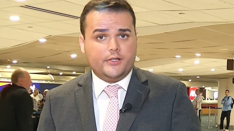 Dylan Lyons giving a news report on location