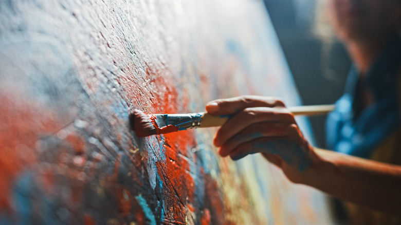 Artist painting on a canvas