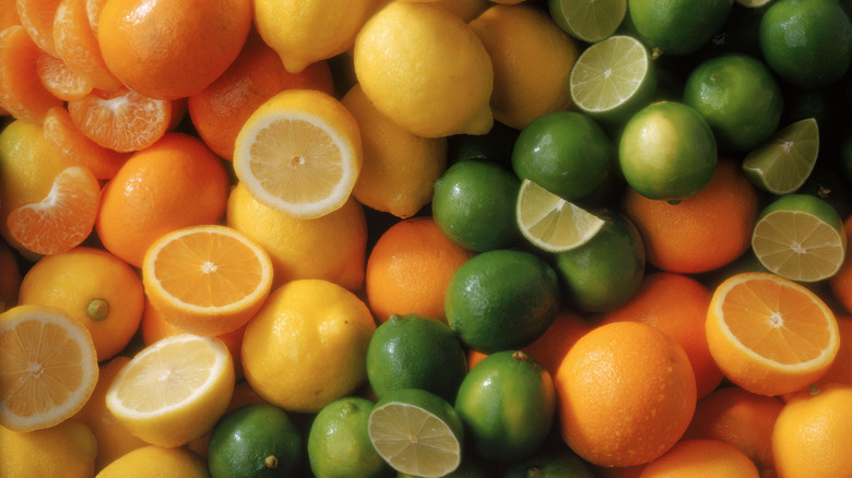 Lots of sliced oranges, lemons, and limes