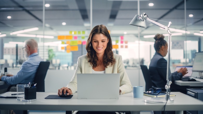 woman sitting at a desk 