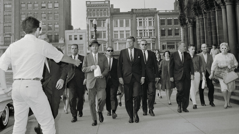 JFK and secret service personnel in the street approached by member of the public
