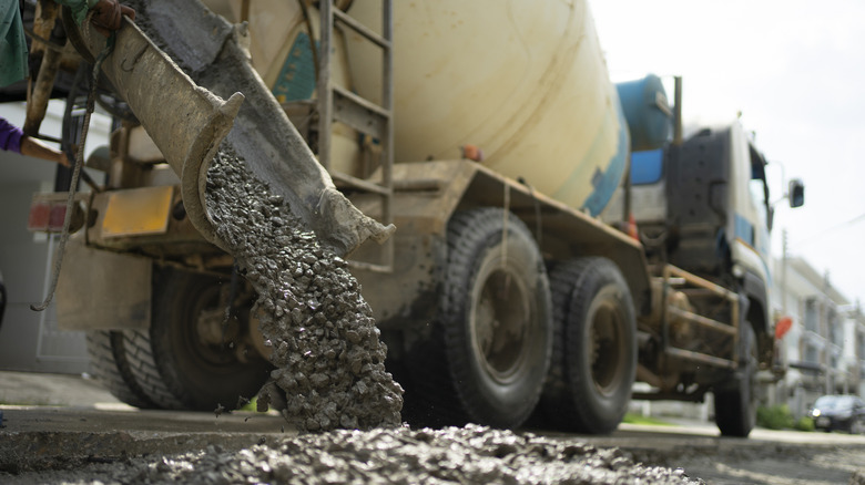 Concrete truck pouring concrete