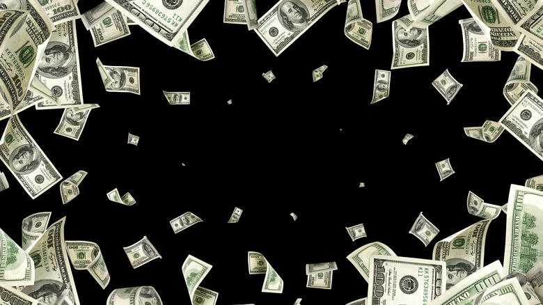 Falling money into black void