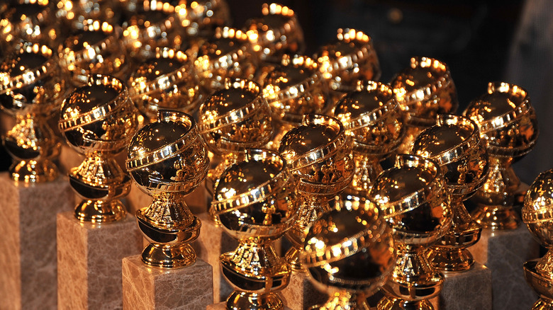 Golden Globe statues in a line