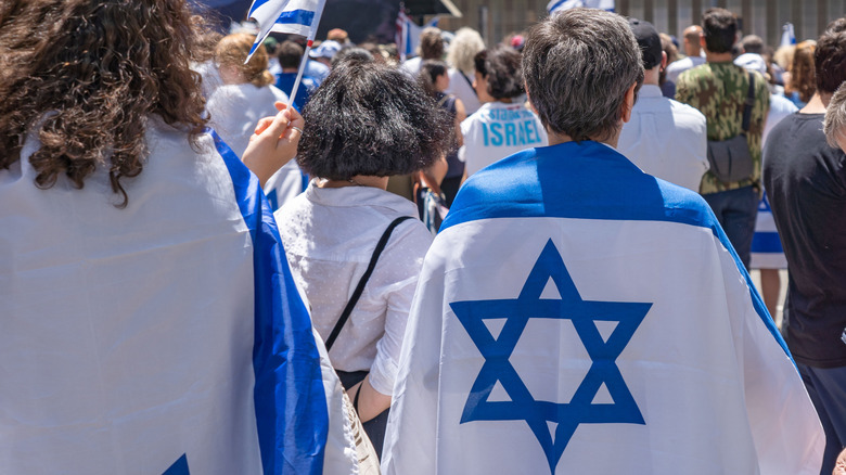 Demonstrators wearing Stars of David
