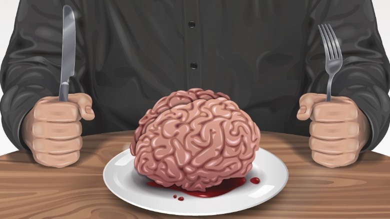 brain dinner plate man holding utensils