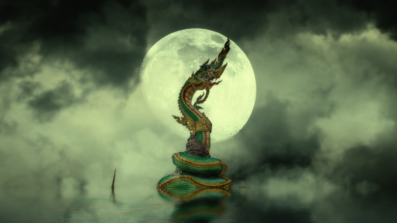 Naga statue on river