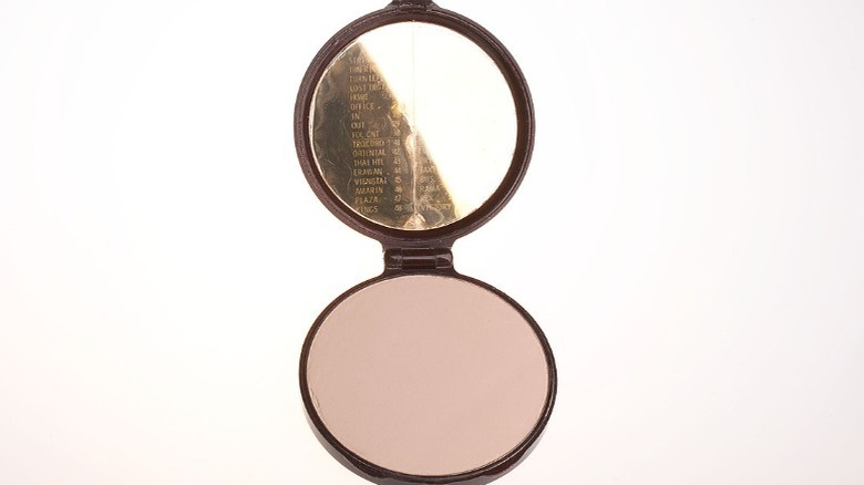 Woman's compact with secret code