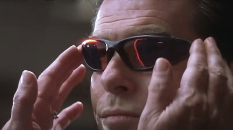 Pierce Brosnan as James Bond wearing glasses