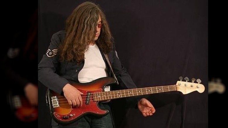 Gunter Nezhoda playing a guitar on stage