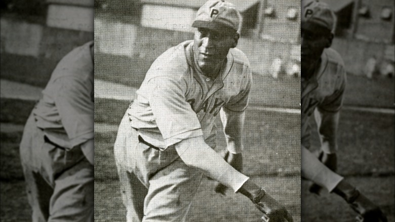 "Smokey" Joe Williams throwing pitch towards camera