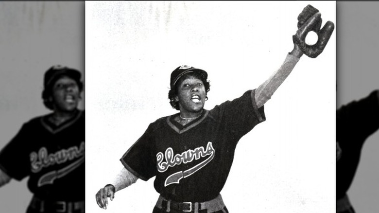 Toni Stone in Clowns uniform catching ball in glove overhead