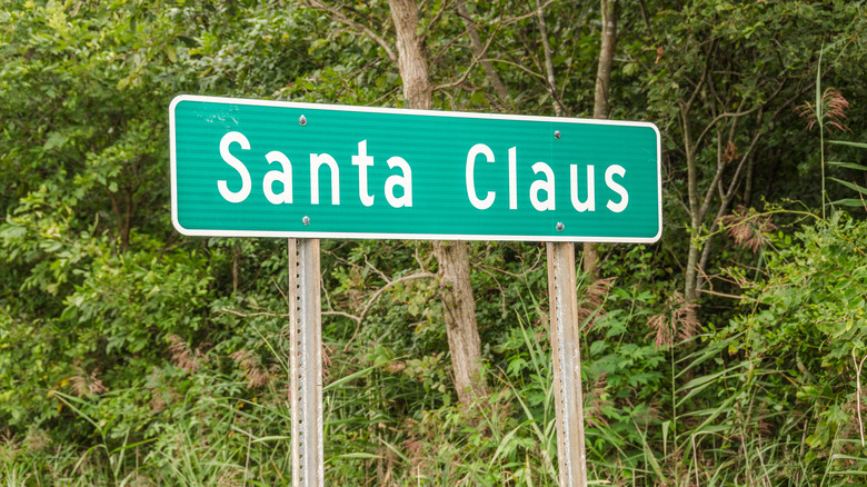 Santa Claus, Indiana sign near trees