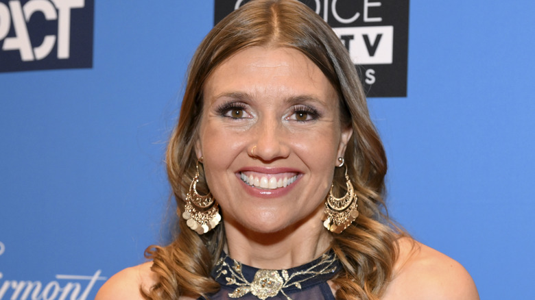 julie stoffer smiling big earrings