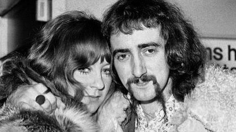 Christine and John McVie hugging each other