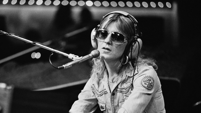 Christine McVie in recording studio wearing sunglasses and headphones