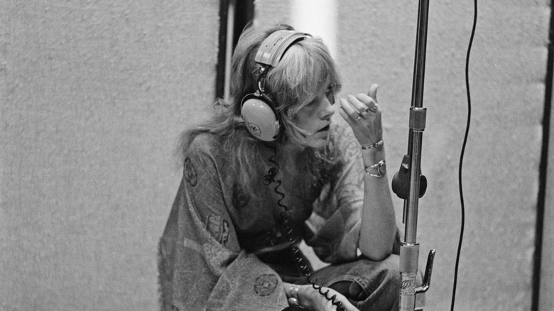 Stevie Nicks sat in recording studio wearing headphones