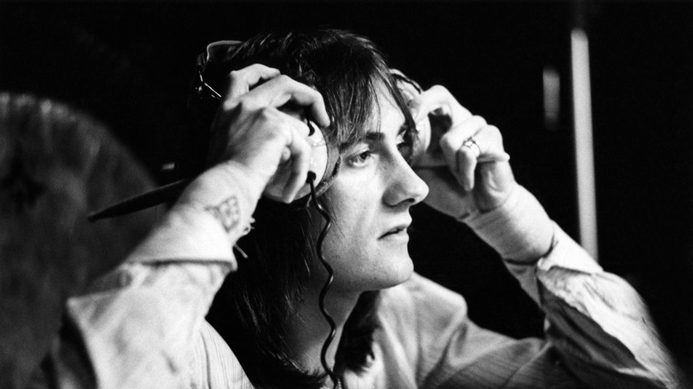 Mick Fleetwood in recording studio putting on headphones