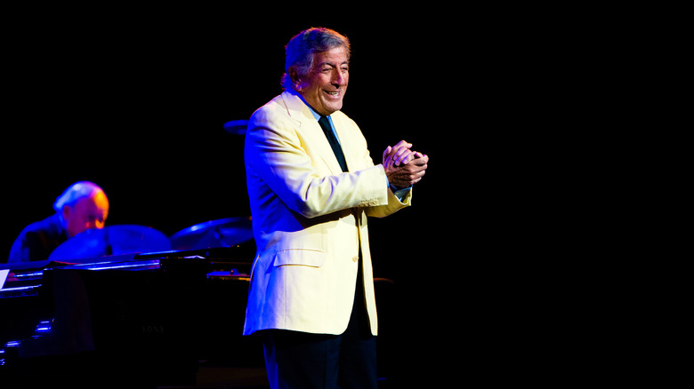 Tony Bennett on stage in white jacket