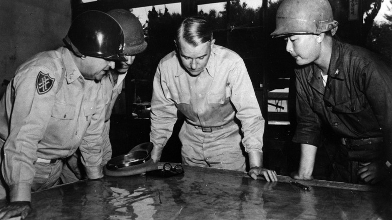 Army officers looking over battle plans
