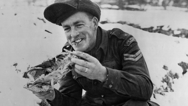 Soldier eating dinner near frontline
