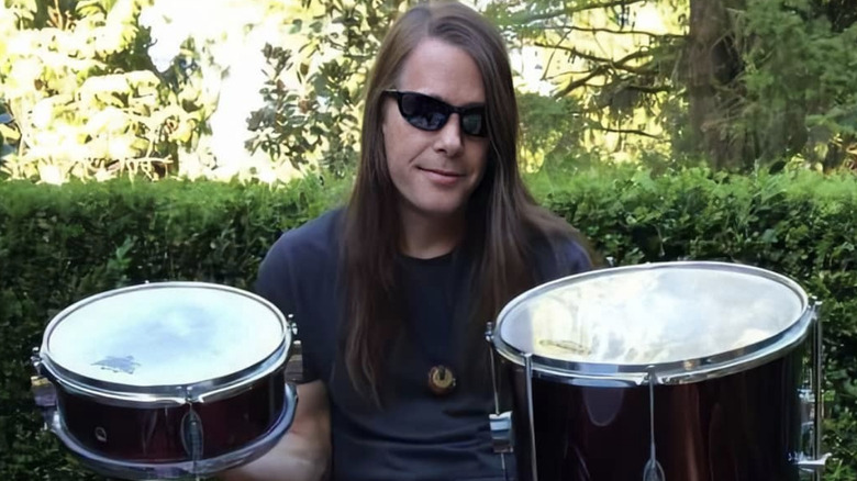 Chad Channing smiling with drums