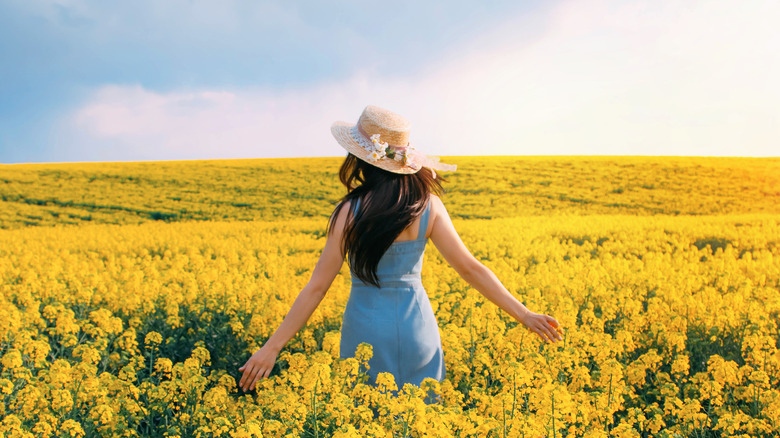 Woman in field of flowers