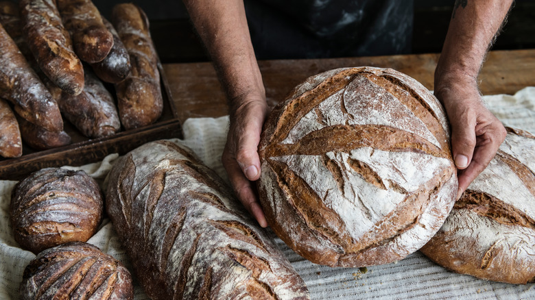 baker holding bread