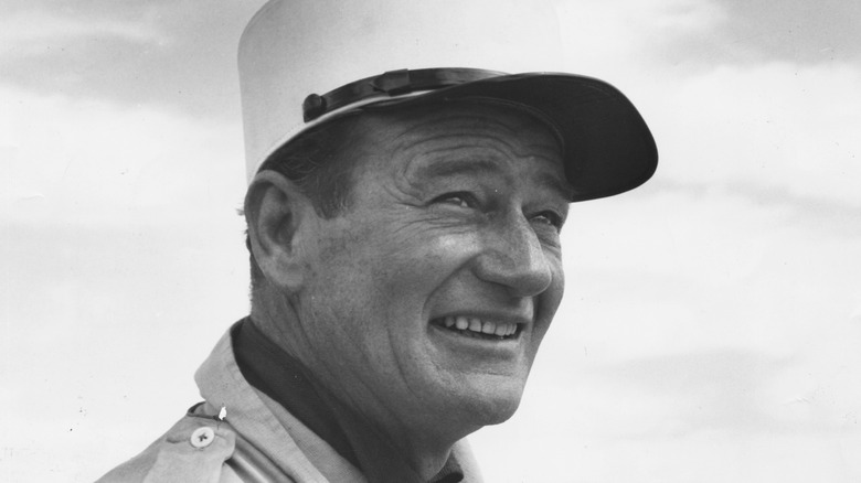 John Wayne in desert wearing hat