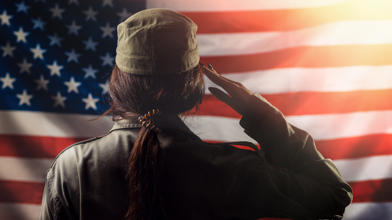 woman saluting American flag