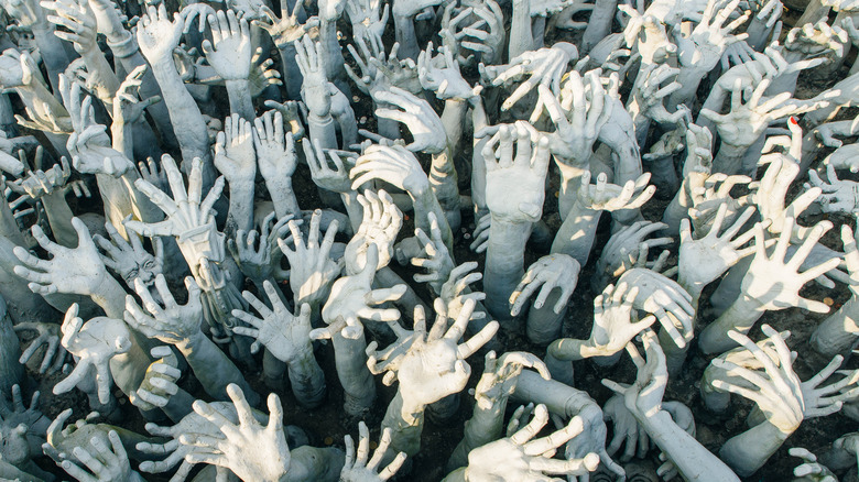 hands reaching upwards