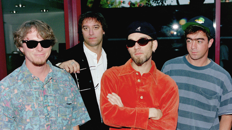 R.E.M. members standing together
