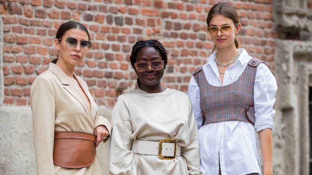 A photograph of three Italian women displaying 21st-century fashion