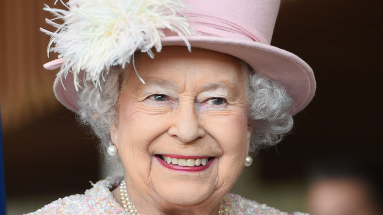 Queen Elizabeth wearing pink hat