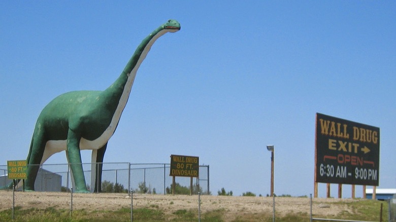 wall drug dinosaur and sign