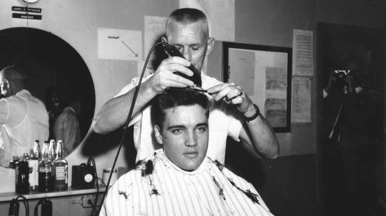 Elvis mid-haircut