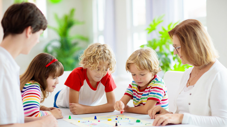 Family of five playing games