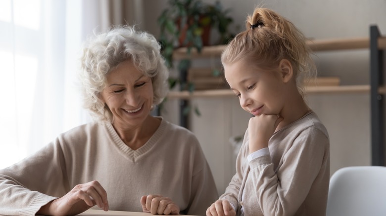 Grandmother and child enjoying boardgame