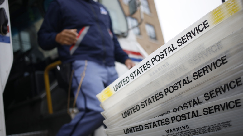 Postal worker near truck