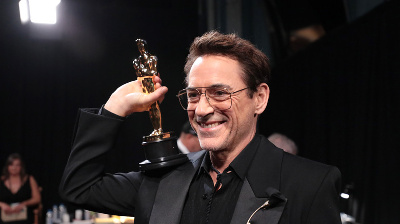 Robert Downey Jr. holding academy award