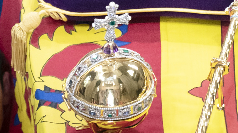 The orb rests on a flag
