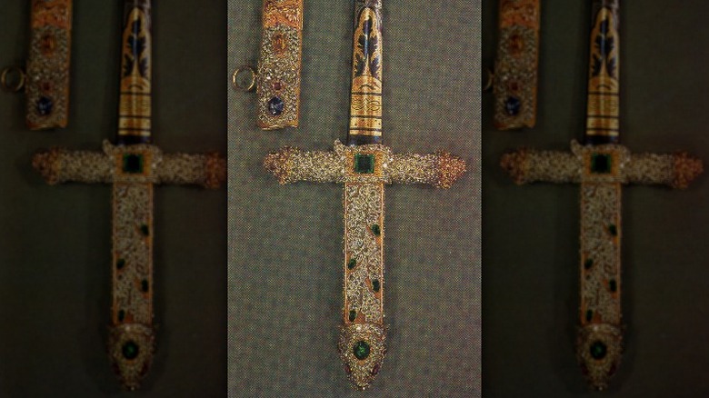 Sword sits by its scabbard