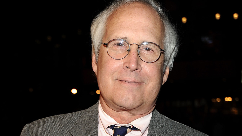 Chevy Chase leaning smirking