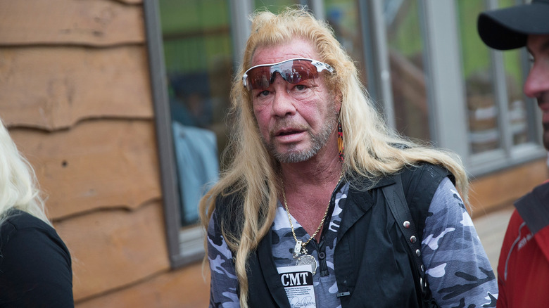 Dog the Bounty Hunter walking outside