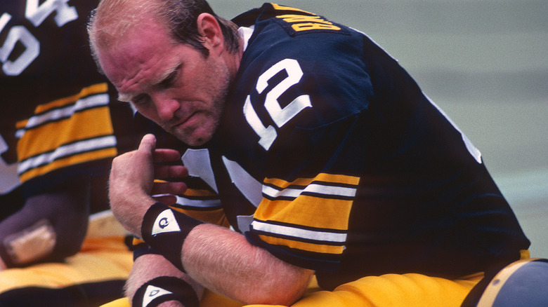 Terry Bradshaw sitting on the sidelines 1980s