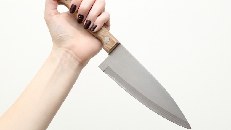 woman holding knife