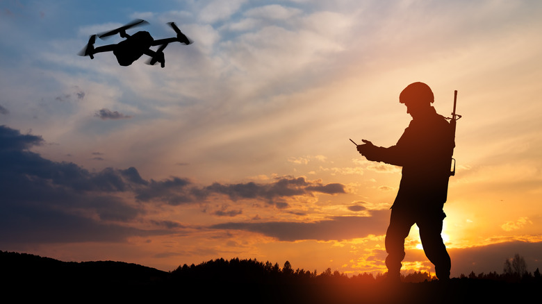 Soldier controlling airborne drone