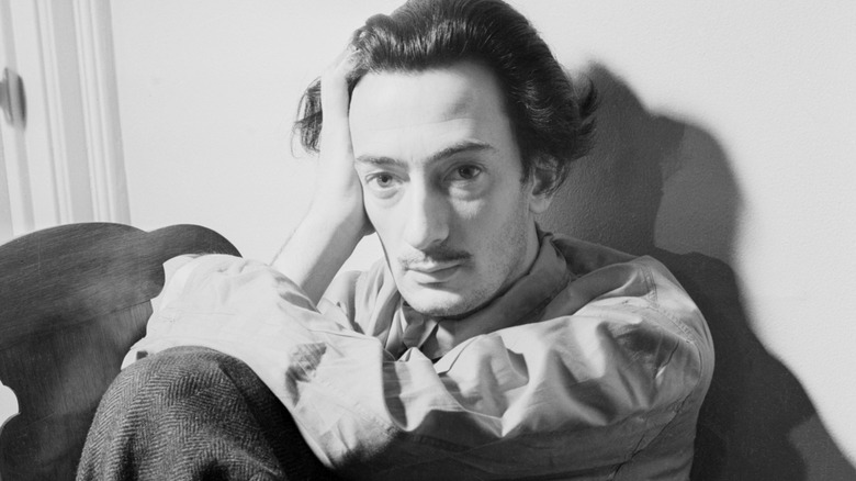 young salvador dali with head on hand