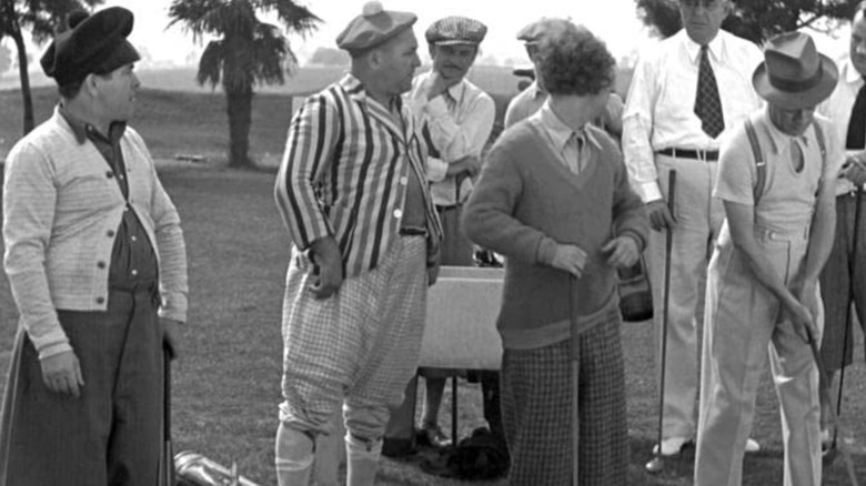 Three Stooges playing golf