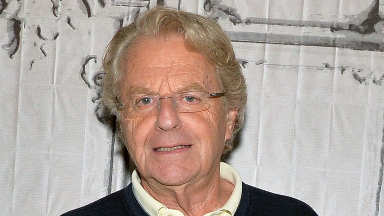 Jerry Springer staring ahead smiling